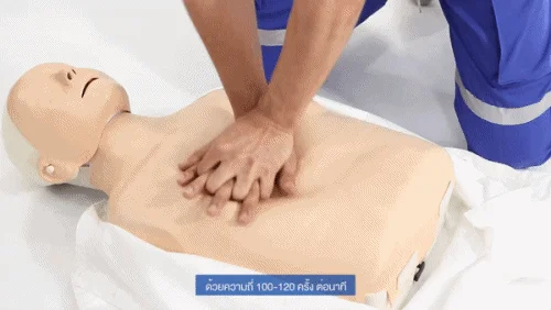 Chest compressions being practised on a training dummy during a CPR demonstration by Bangkok Hospital Phuket, one of the hospitals near Kamala