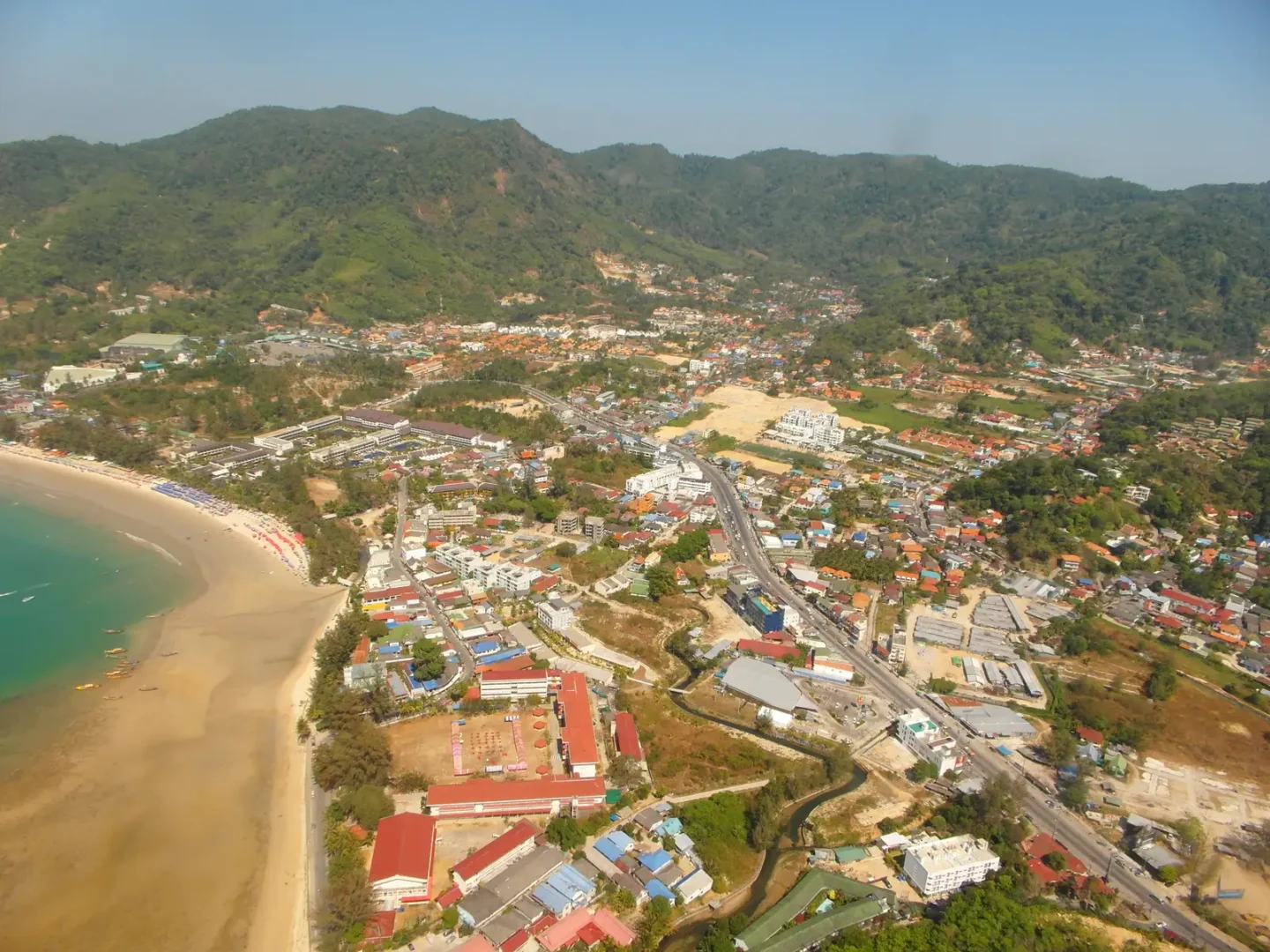 Aerial view of Kamala village and Kamala Beach on the west coast of Phuket